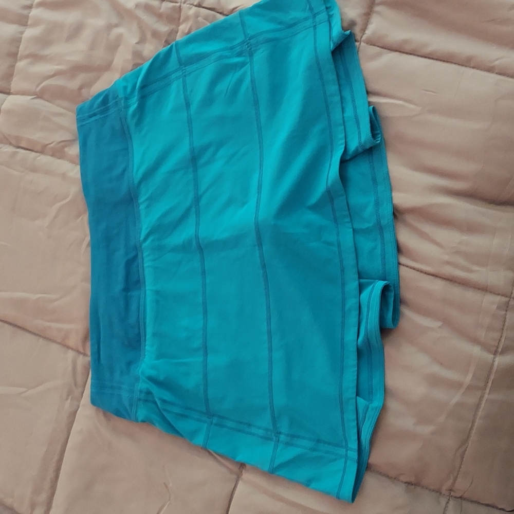Lululemon teal skirt with matching built in shorts.